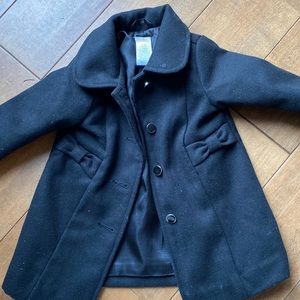 Gymboree black dress coat with buttons and pockets with bows. 6-12 months
